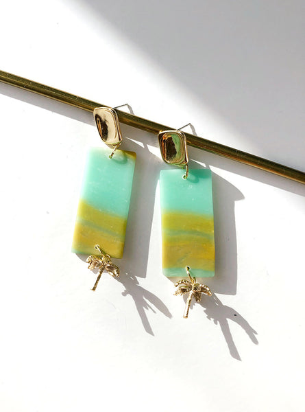  flat lay yellow turquoise green Polymer clay handmade earrings with gold plated silver earring post and palm tree pendant 